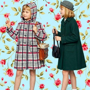 May include: Two coats worn by children. One is a white, black, and red plaid hooded coat with toggle buttons and two pockets. The other is a solid dark green coat with a collar, buttons, and two pockets, paired with a small black hat and bag.