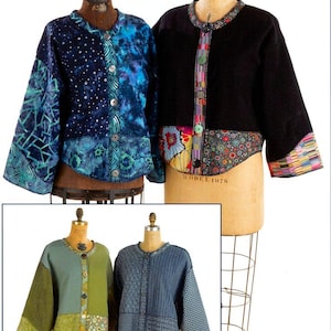 May include: Four cropped jackets displayed on dress forms. Two jackets feature blue tie-dye and geometric patterns with buttons. One black jacket has a floral hem and patterned trim. One green jacket has patchwork panels. One blue jacket has varied fabric textures.
