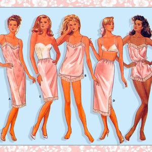 May include: Illustration of five different styles of lingerie in shades of pink. The styles include a slip dress, a bustier with a skirt, a camisole and shorts set, a bra and skirt set, and a romper. Each style is trimmed with lace.