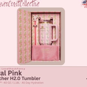 May include: A Stanley x LoveShackFancy 40 oz Flowstate H2.0 tumbler in a floral pink pattern, presented in a matching gift box. The set includes a pink straw with a bow-shaped topper and a soft pink fabric pouch, all featuring a coordinated floral design.