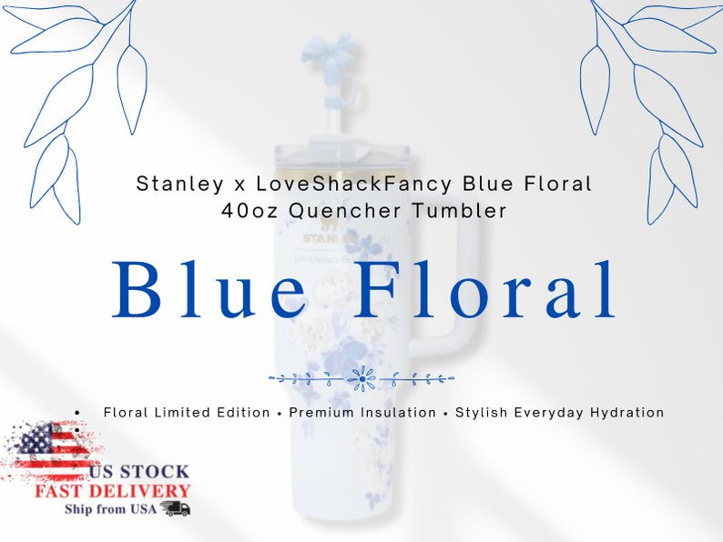 May include: A white 40oz Stanley Quencher tumbler with a blue floral design. The tumbler has a handle and a lid with a straw. The text "Blue Floral" is displayed in large blue letters. The text "Stanley x LoveShackFancy" is also visible.