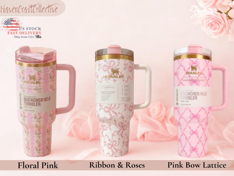May include: Three Stanley Quencher H2.0 tumblers with handles and lids. The left tumbler features a pink floral pattern, the center tumbler has a pink ribbon and rose design, and the right tumbler displays a pink bow lattice pattern.