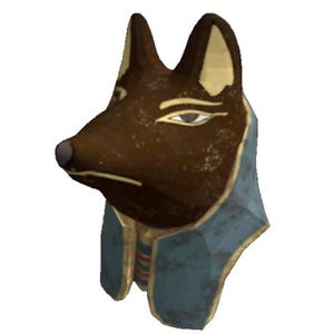 May include: A brown and gold Anubis statue with a blue and gold collar. The statue is a depiction of the Egyptian god of the dead, Anubis, with a jackal head and human body.