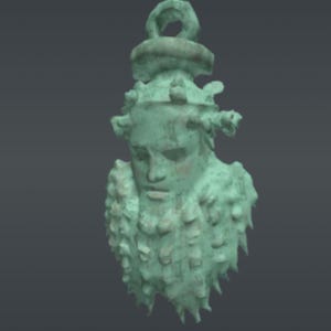 May include: A weathered, verdigris-colored pendant featuring a sculpted face with a crown and a textured beard. The pendant has a loop at the top for hanging and is likely made of metal. The design evokes classical or historical themes.