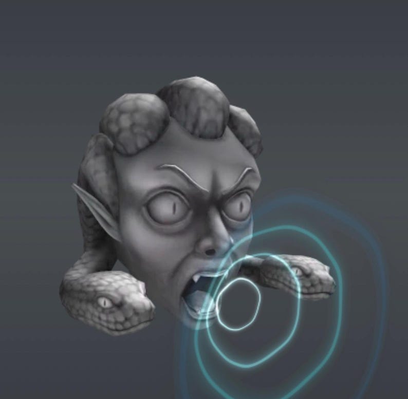 May include: A gray sculpture of Medusa's head with snakes for hair and two snakes emerging from the sides of her head. The sculpture has an open mouth and is surrounded by blue concentric circles.