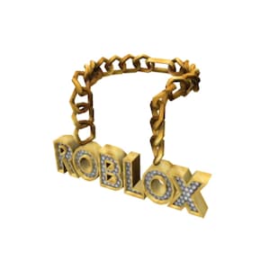 May include: A gold-colored chain necklace with the word "ROBLOX" spelled out in large, block letters. The letters are encrusted with small, clear gemstones. The chain is made of interlocking links.