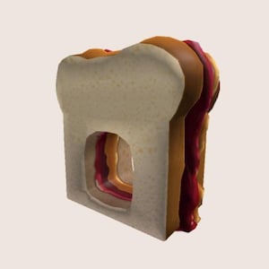 May include: A peanut butter and jelly sandwich with a bite taken out of it. The sandwich is made with two slices of white bread, peanut butter, and jelly.