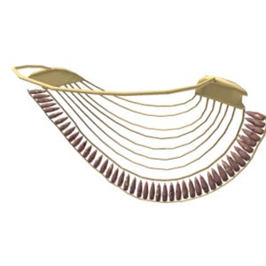 May include: A gold-colored decorative object with a curved, fan-like design. It features a series of parallel lines extending from a central bar, with small, brown, teardrop-shaped elements along the curved edge. The object has a symmetrical shape.