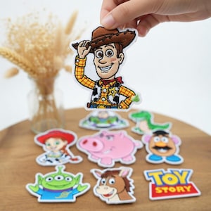 May include: A set of three ceramic mugs with a speckled, matte finish. The mugs are in shades of cream, light gray, and dark gray. Each mug has a simple, minimalist design, perfect for coffee or tea.