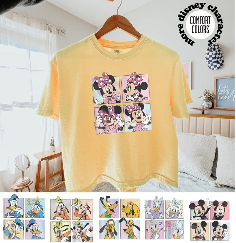 May include: Yellow t-shirt featuring a four-panel graphic of Minnie Mouse in various poses. The shirt has short sleeves and a crew neck. The text "more disney character" and "COMFORT COLORS" is printed on the shirt.