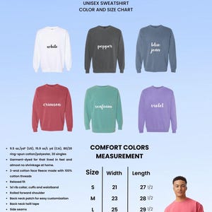 May include: A unisex sweatshirt color and size chart. The image displays sweatshirts in white, pepper, blue jean, crimson, seafoam, and violet. Measurements are provided in inches for width and length, ranging from 21 to 28 inches wide and 27 1/2 to 31 1/2 inches long.