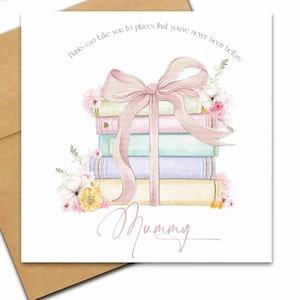 May include: A card with a watercolour illustration of a stack of books in pastel shades, tied with a pink ribbon. The card is decorated with flowers and the word "Mummy" in cursive. The text reads "Books can take you to places that you've never been before".