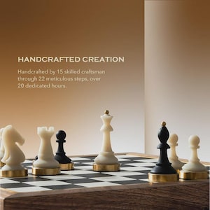 May include: A handcrafted chess set with white and black pieces on a checkered board. The pieces have gold-colored bases. The text "HANDCRAFTED CREATION" is visible in the background.