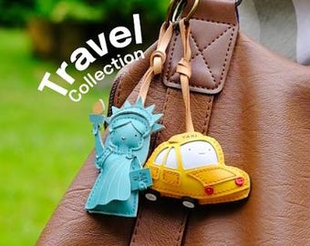 ピュイフォルカ　キィーホルダーまたはバックチャームに 飛行機の旅行バッグチャームとスーツケースキーホルダー、旅行者への