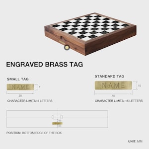 May include: A wooden chess set with a black and white checkered board. The set includes an engraved brass tag with the word "NAME" and the text "ENGRAVED BRASS TAG". The small tag is 30mm long and the standard tag is 45mm long.