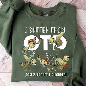 May include: Green sweatshirt with the text "I suffer from OTD [Obsessive Turtle Disorder]" and a cartoon image of five sea turtles.