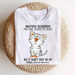 a white t - shirt with a picture of a cat saying multiple scleross