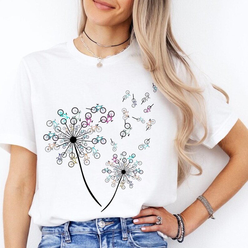 a woman wearing a white t - shirt with a dandelion design