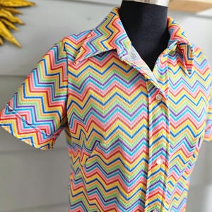 May include: A set of three ceramic nesting bowls in shades of blue, green, and white. The bowls feature a speckled glaze and a simple, modern design. The largest bowl is approximately 6 inches in diameter.