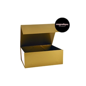 May include: A gold gift box with a magnetic closure. The box is open and the lid is propped up. The box is labeled "magnetique. Luxe Gifting Co."