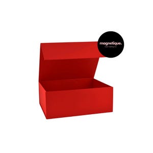 May include: A red, rectangular gift box with a magnetic closure. The box is open and the lid is propped up. The box is made by magnetique. Luxe Gifting Co.