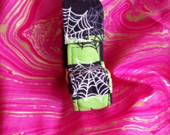 Green & black with spider webs and cross bones