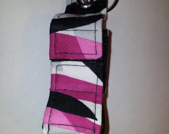 white background with strips of black gray dark pink light pink colors