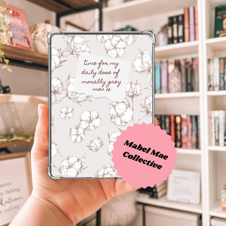 May include: A clear phone case featuring a light gray background with cotton plant illustrations. The case has the text "time for my daily dose of morally grey men" and a pink sticker that says "Mabel Mae Collective".