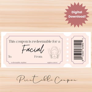 May include: A light pink printable coupon for a facial treatment. The coupon features the text "This coupon is redeemable for a Facial" and includes a graphic of a face receiving a facial. The coupon also has the text "Digital Download!"