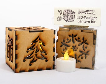 Winter holiday 3-inch laser cut cube kit featuring Snowflake, Christmas Tree, Snowman, Present, and Mitten Cutout Designs