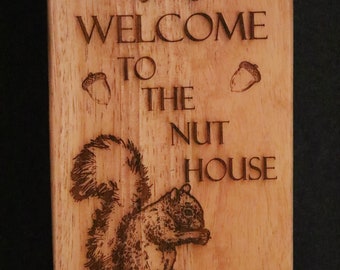 Welcome to the Nuts house White Oak sign 20 in. long by 4 3/4 in wide.
