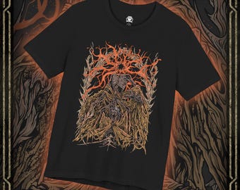 May include: A black short-sleeve t-shirt featuring a detailed graphic print on the chest. The artwork depicts a skeletal figure draped in tattered, mustard-yellow fabric, surrounded by intricate, swirling orange and red flame-like patterns.