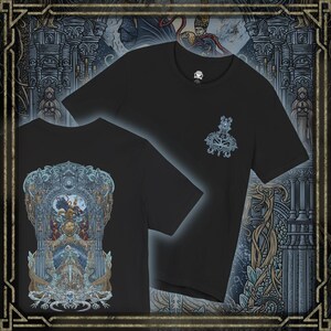 May include: Black t-shirts with a detailed fantasy illustration on the back and a smaller design on the front. The back design features a complex scene with figures, architecture, and a central emblem. The front design includes a stylized emblem and the letters "OYD".
