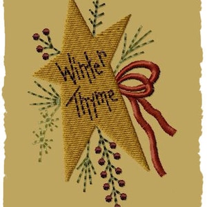 May include: Embroidered design of a gold star with the text "Winter Thyme" in brown lettering. The star is surrounded by red and green embroidery, resembling holly and berries.