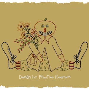 May include: A whimsical pumpkin-faced character with a stitched smile sits with legs outstretched, holding a bouquet of flowers. The character is wearing a simple, stitched outfit and has a brown background.