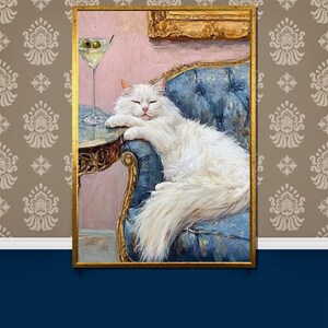 May include: A framed painting depicts a white cat lounging on a blue velvet chair next to a table with a martini. The cat is the focal point, with a relaxed pose. The painting has a gold frame and is set against a patterned wallpaper.