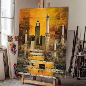 May include: An original oil painting on canvas depicting a cityscape with minarets, a clock tower, and the Kaaba. The artwork features a warm color palette of yellows, oranges, and browns, with detailed architectural elements and a textured finish.