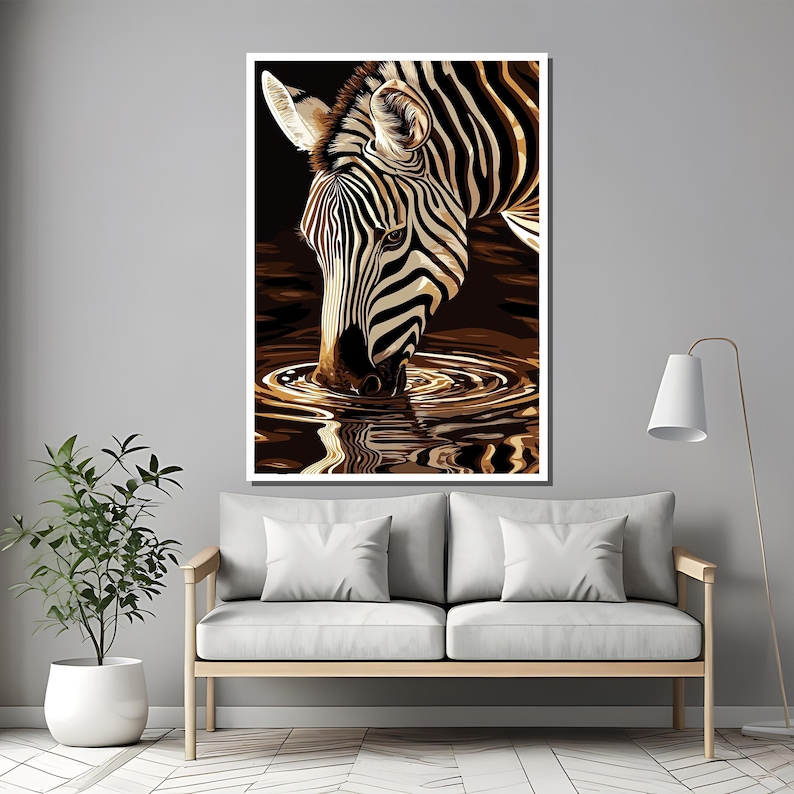May include: A black and white zebra with black stripes drinks from a pool of water. The zebra's reflection is visible in the water.