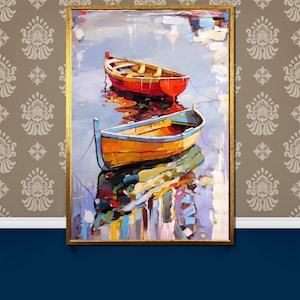 May include: A painting depicting two wooden boats on a tranquil body of water. The boats are painted in shades of red, yellow, and blue. The water is painted in shades of blue, green, and white. The painting is framed in gold.