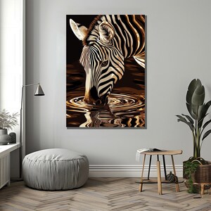 May include: A black and white zebra with black stripes drinks from a pool of water. The zebra's reflection is visible in the water.
