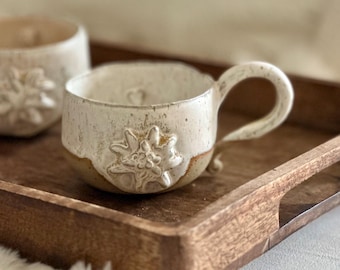 Handcrafted Edelweiss Ceramic Mug: Beige Floral Coffee Cup