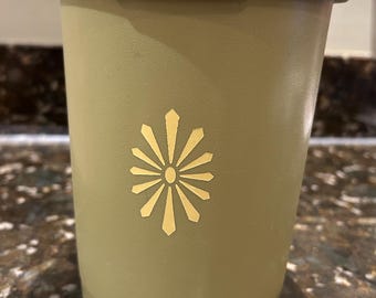 Vintage Tupperware Servalier canister in avocado green with starburst design