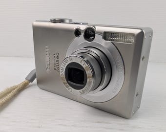 Cargador para cámara digital compacta Canon IXUS 60 (en funcionamiento)