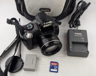 Cámara digital Canon PowerShot SX30 IS, 14,1 MP, zoom de 35x, con batería y cargador.