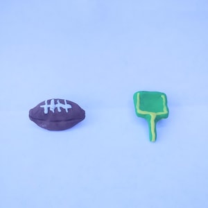 Football and field goal croc charms.