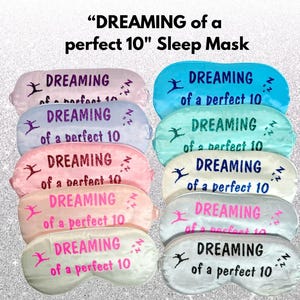 May include: Ten pink, white, and blue satin sleep masks with the text "DREAMING of a perfect 10" printed on each one.