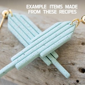 May include: A pair of light blue earrings with a textured finish. The earrings are made of polymer clay and have a simple, modern design.