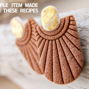 May include: A pair of brown clay earrings with a textured surface and gold accents. The earrings are shaped like a fan and have a rounded top.