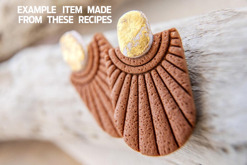 May include: A pair of brown clay earrings with a textured surface and gold accents. The earrings are shaped like a fan and have a rounded top.