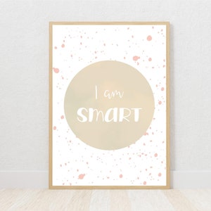 May include: A white framed poster with a pink and white splatter background. A large beige circle in the center has the text "I am SMART" in white.